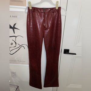 Red snakeskin flare pants
